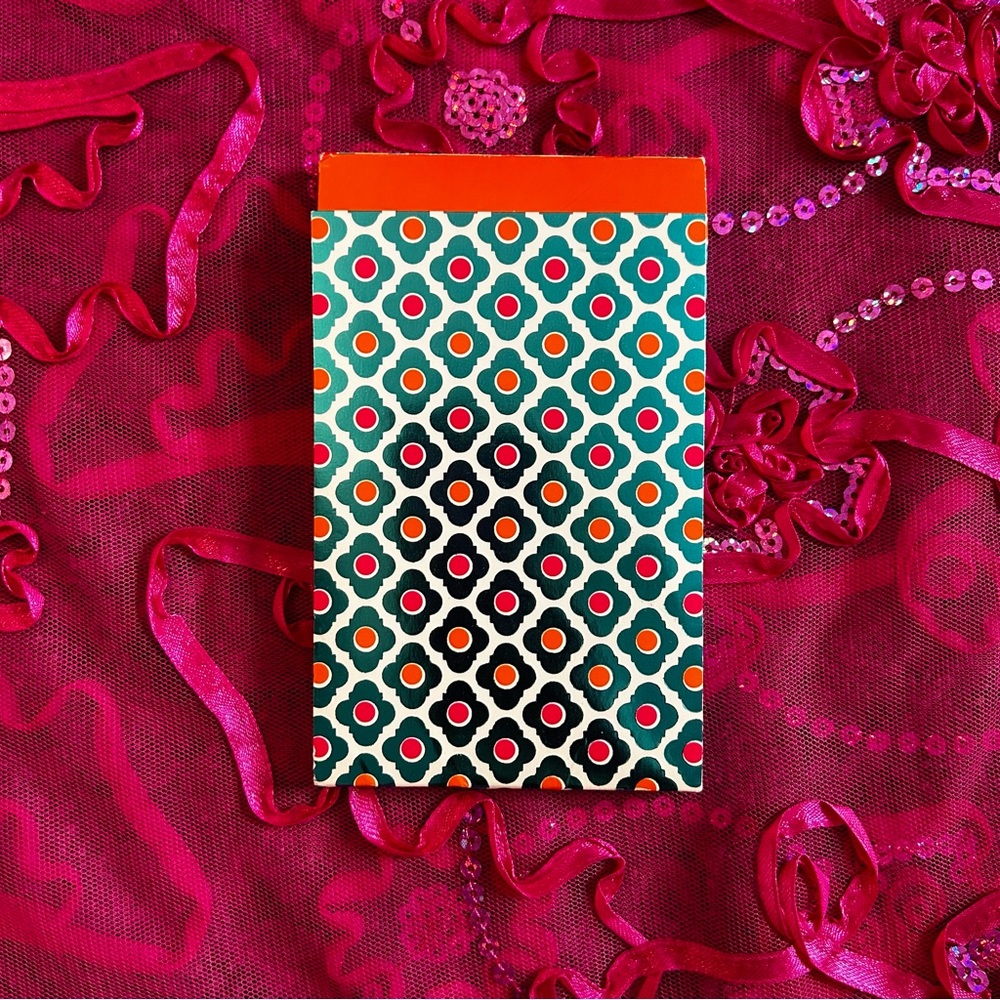 turquoise and orange unlined notepad
